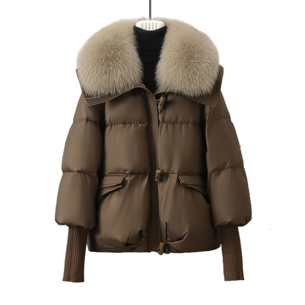 Brown puffer jacket with fur hood on a mannequin against a neutral background