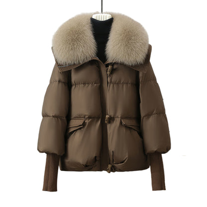 Brown puffer jacket with fur hood on a mannequin against a neutral background