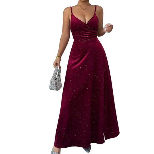Woman wearing a burgundy evening gown with a plain background